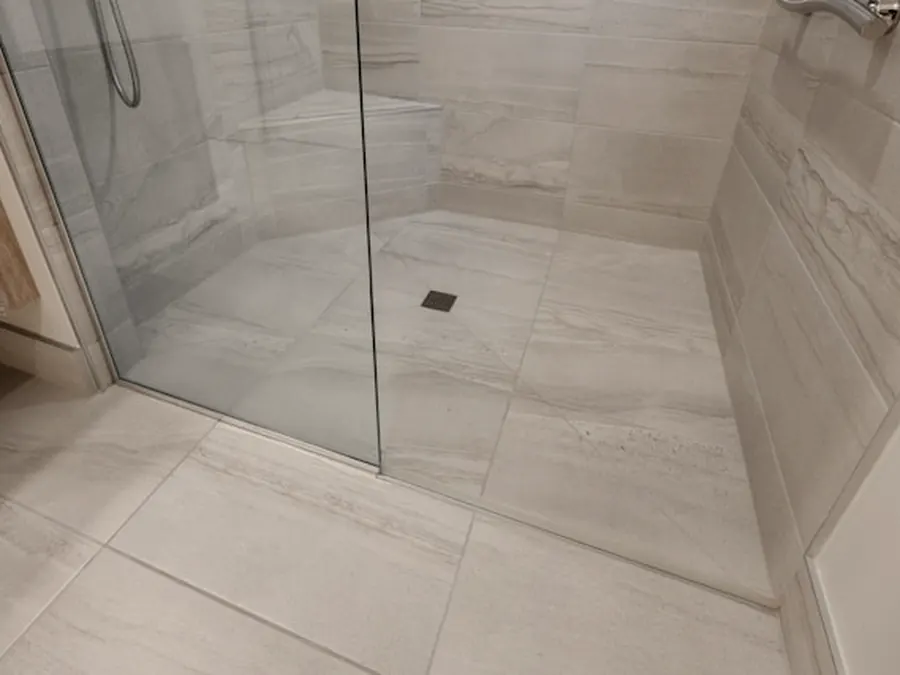 A finished tiled shower enclosure.